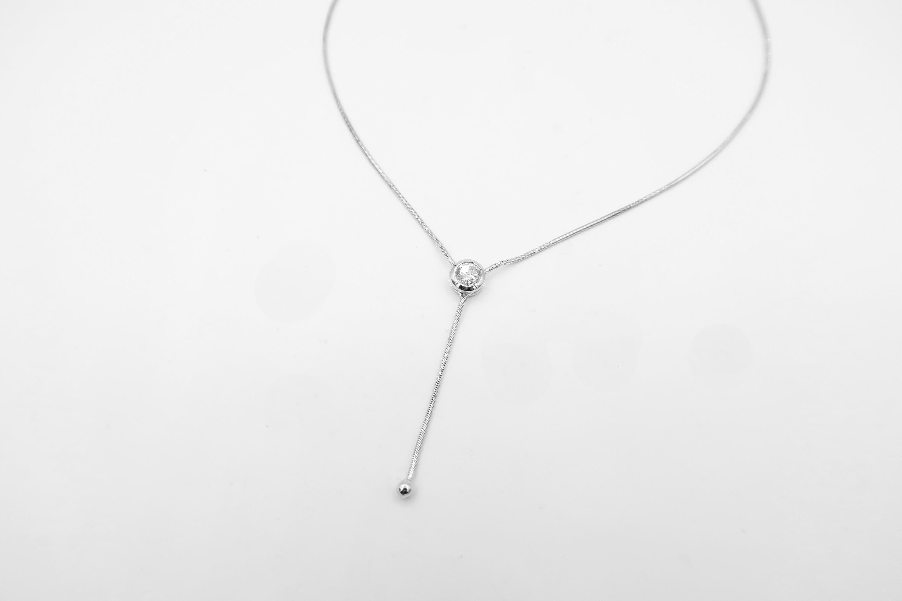 0.64 Carat Solitaire Bezel-Set Diamond 18K White Gold Y-Necklace

Diamond: Round Brilliant, 0.64 ct
Gold: 18K White Gold, 6.3 g

Length: 15