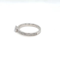 0.64 Carats Sapphire Baguette Bezel Solitaire Ring with Diamonds