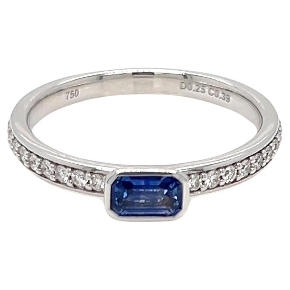 0.64 Carats Sapphire Baguette Bezel Solitaire Ring with Diamonds  For Sale