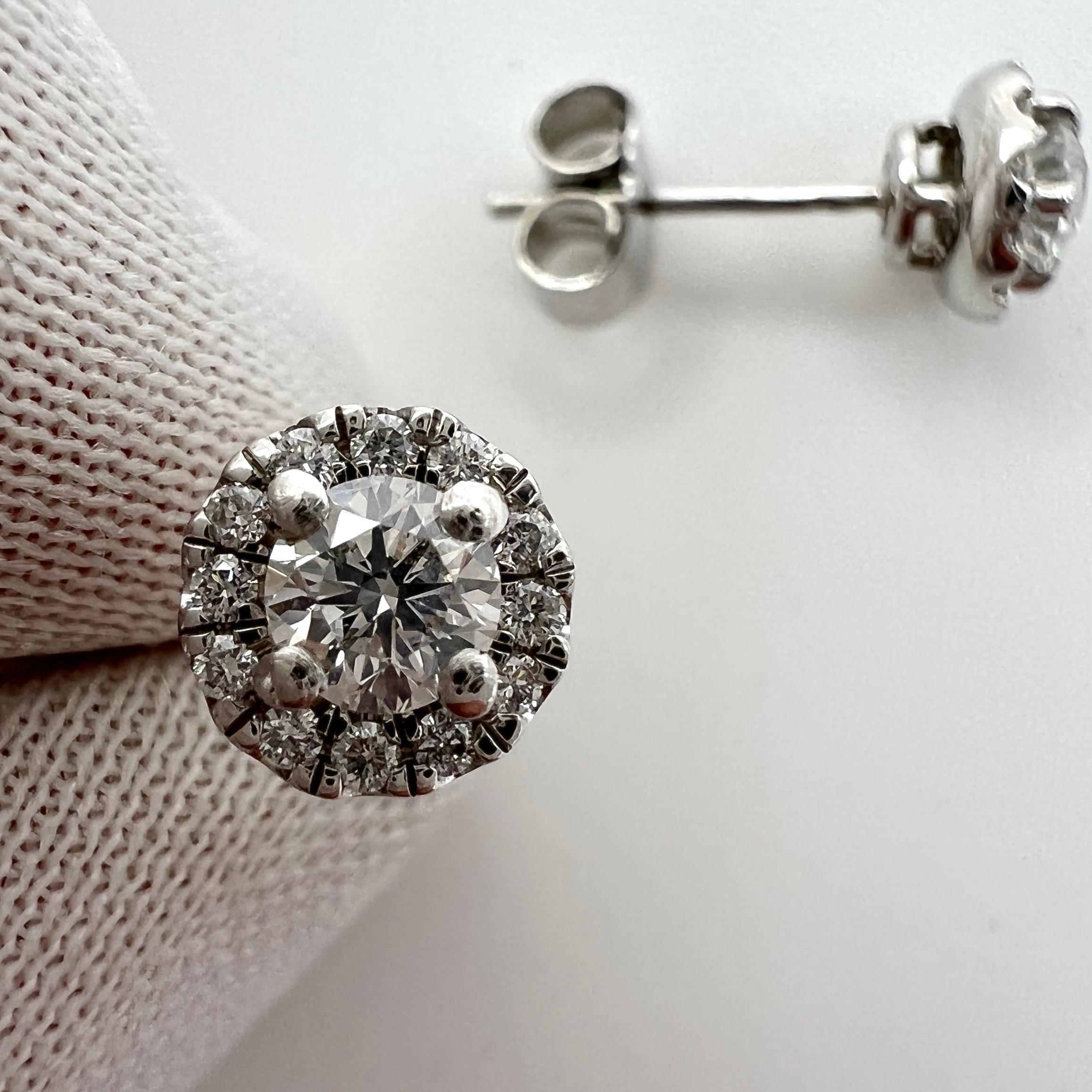 IGI Certified F Colour White Colourless Round Cut Natural Diamond Halo Earrings.

0.64 Total carat untreated white diamonds set in beautiful halo earrings studs. 

The centre diamonds are fully certified by IGI Antwerp Confirming them as natural F