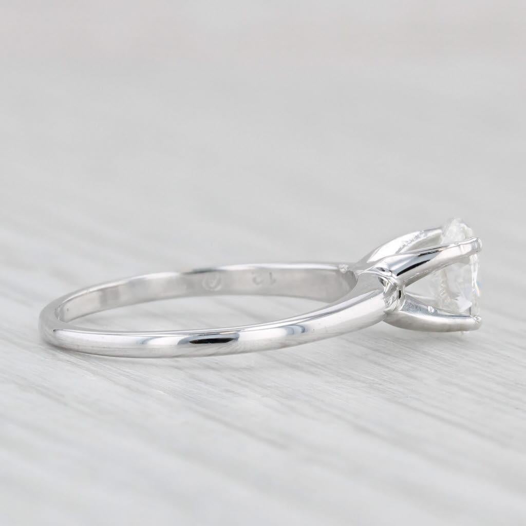 Gemstone Information:
- Natural Diamond -
Carats - 0.64ct 
Cut - Oval Brilliant
Color - G
Clarity - I1
Please note there is a surface reaching inclusion.

Metal: 18k White Gold
Weight: 2.5 Grams 
Stamps: 18k
Face Height: 6.9 mm 
Rise Above Finger: