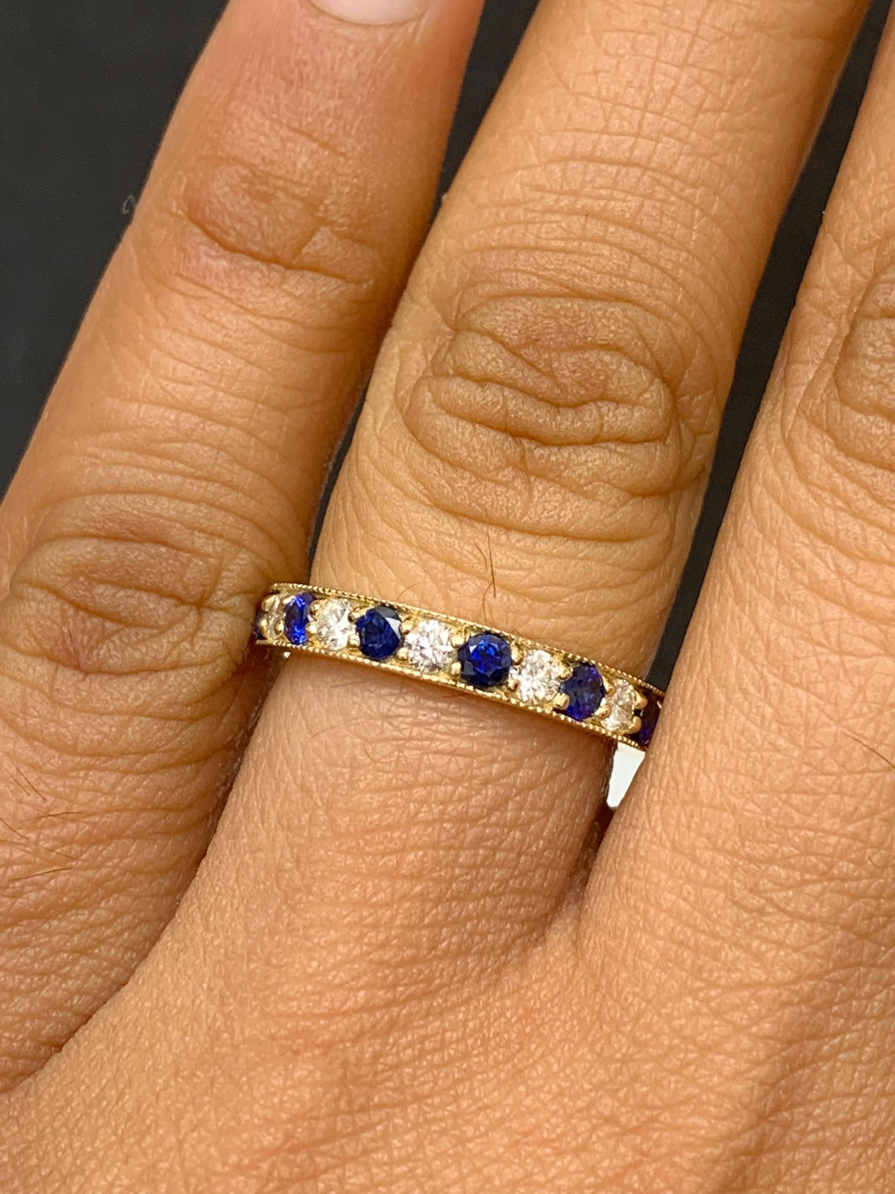 Handcrafted to perfection; showcasing color-rich brilliant-cut blue sapphires that elegantly alternate brilliant-cut diamonds in a 14k yellow gold setting. 
The 7 Blue Sapphires weigh 0.65 carats total and 6 diamonds weigh 0.30 carats total.

Size