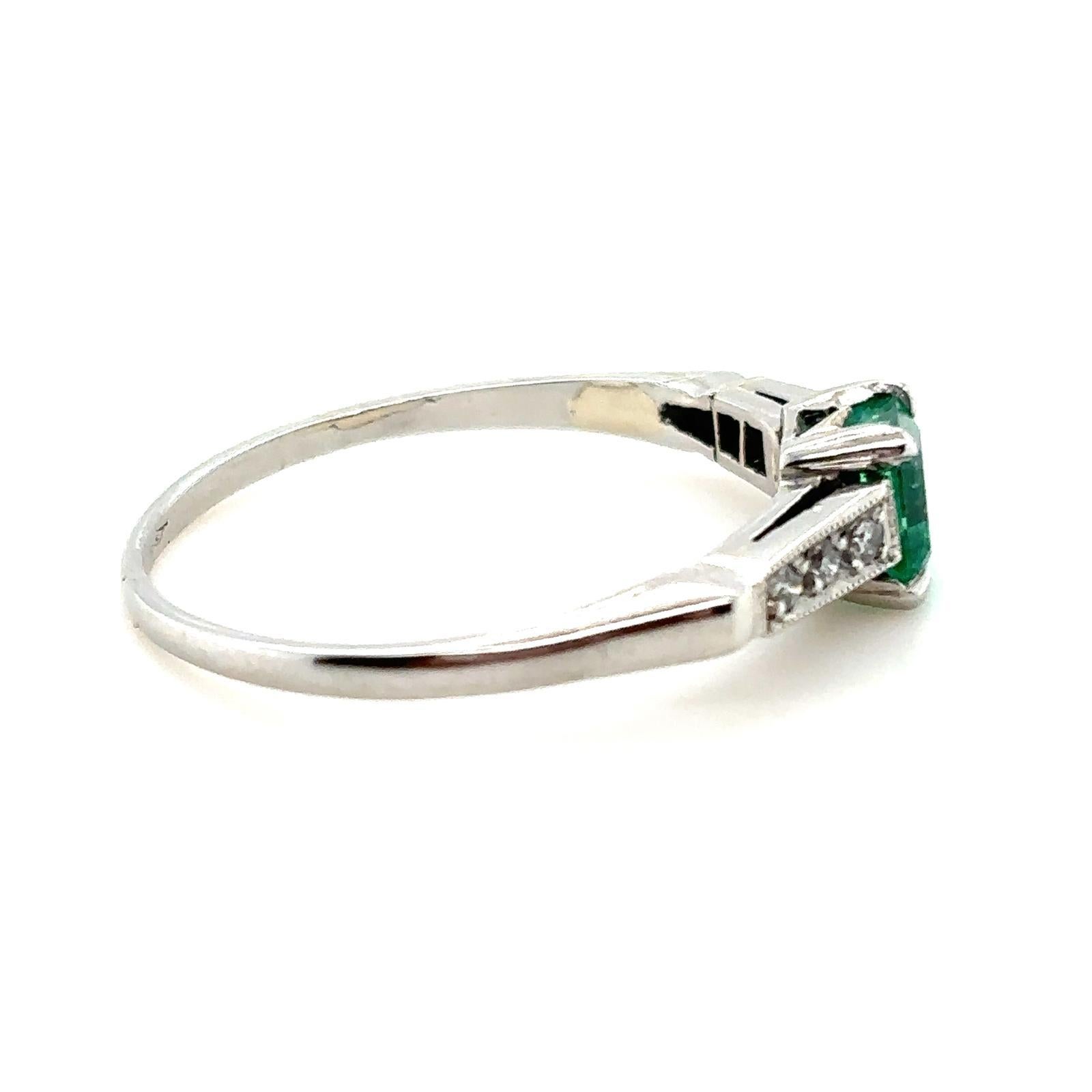 0.65 carat Columbian emerald and diamond platinum engagement ring. In Good Condition For Sale In London, GB