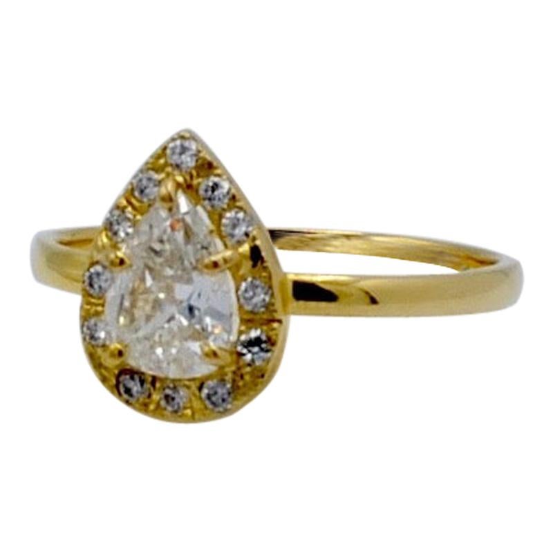 0.65 Carat Diamond Pear Shape with Diamond Halo Engagement Ring For Sale