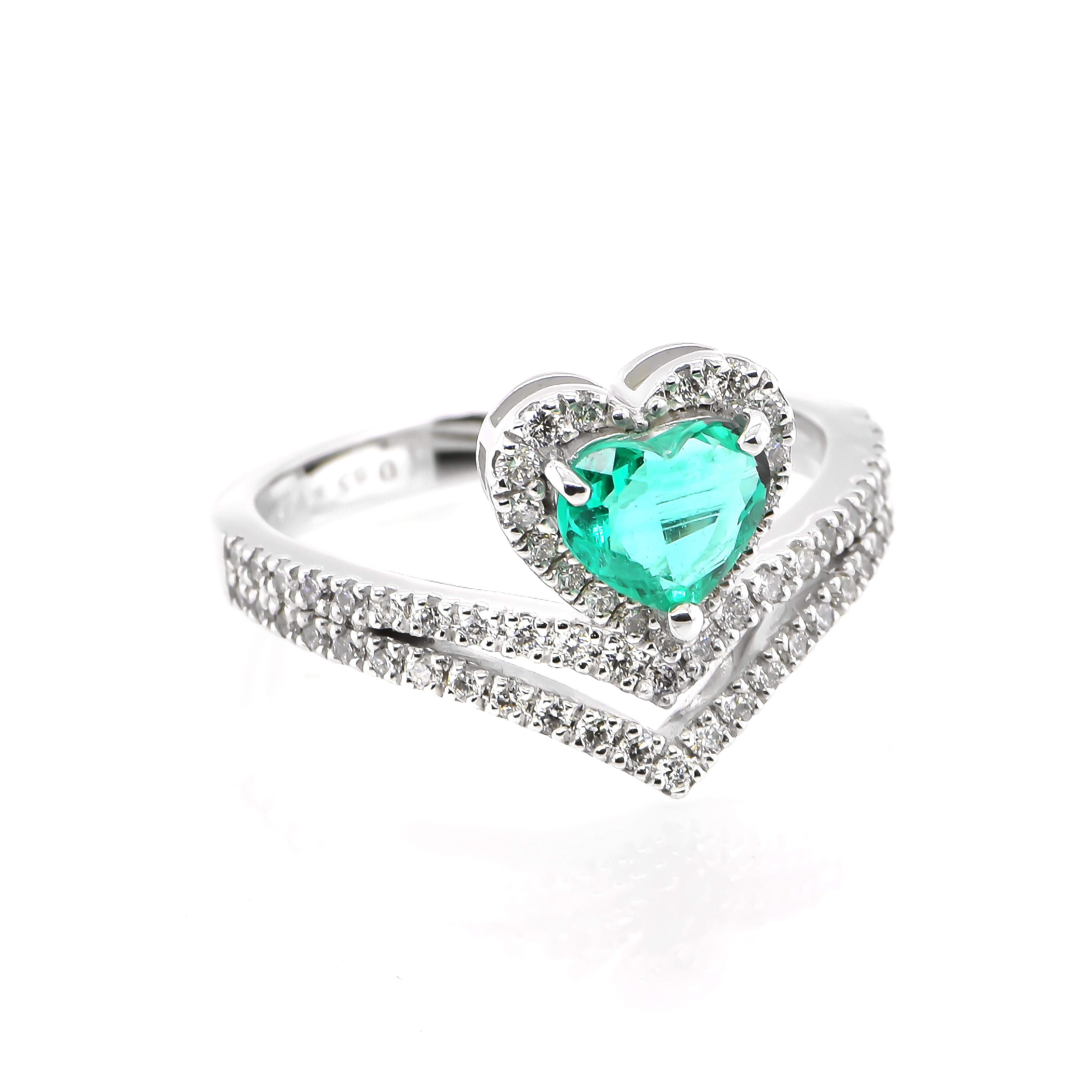 A stunning ring featuring a 0.65 Carat Natural Emerald and 0.42 Carats of Diamond Accents set in Platinum. People have admired emerald’s green for thousands of years. Emeralds have always been associated with the lushest landscapes and the richest