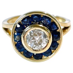 Bague en or jaune avec diamant taille européenne et saphir bleu