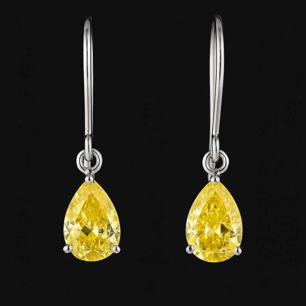 Taille poire Paire de diamants en forme de poire de 0,65 carat de couleur jaune intense fantaisie - Diamant naturel de succession en vente