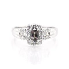 0.65 Carat, Natural, Color-Changing Alexandrite and Diamond Ring Set in Platinum