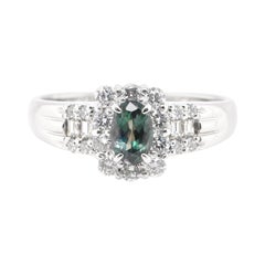 0.65 Carat, Natural, Color-Changing Alexandrite and Diamond Ring Set in Platinum