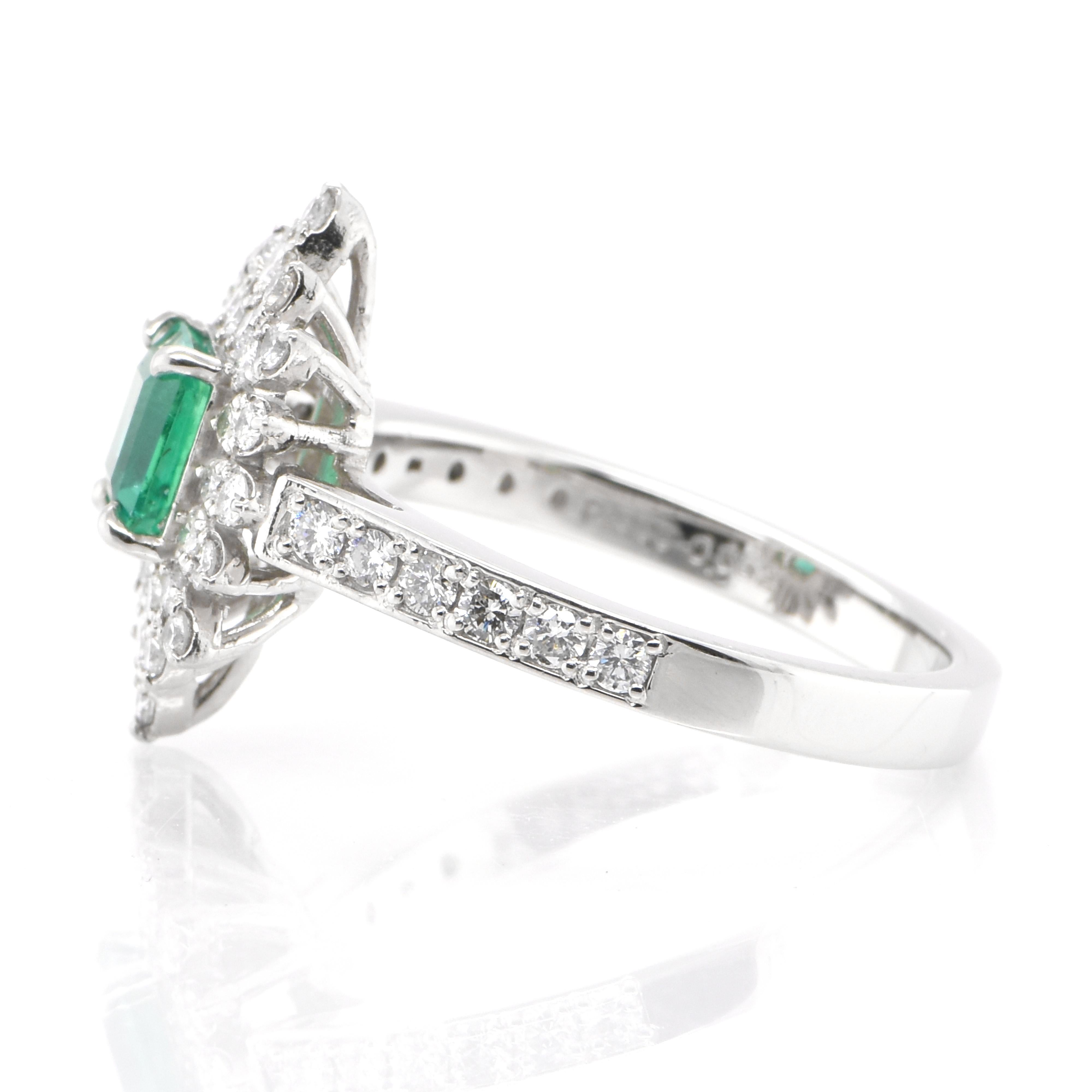 Emerald Cut 0.65 Carat Natural Emerald and Diamond Double Halo Ring Set in Platinum For Sale