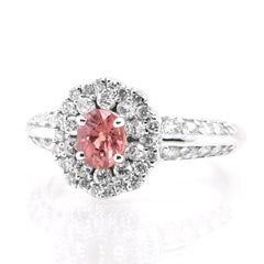 0.65 Carat Natural Padparadscha Sapphire and Diamond Ring Set in Platinum