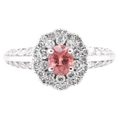 0.65 Carat Natural Padparadscha Sapphire and Diamond Ring Set in Platinum