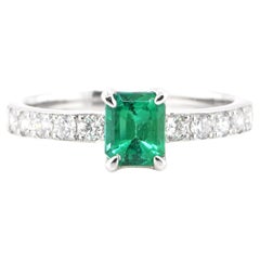 0.65 Carat Natural Vivid Green Emerald & Diamond Solitaire Ring Set in Platinum