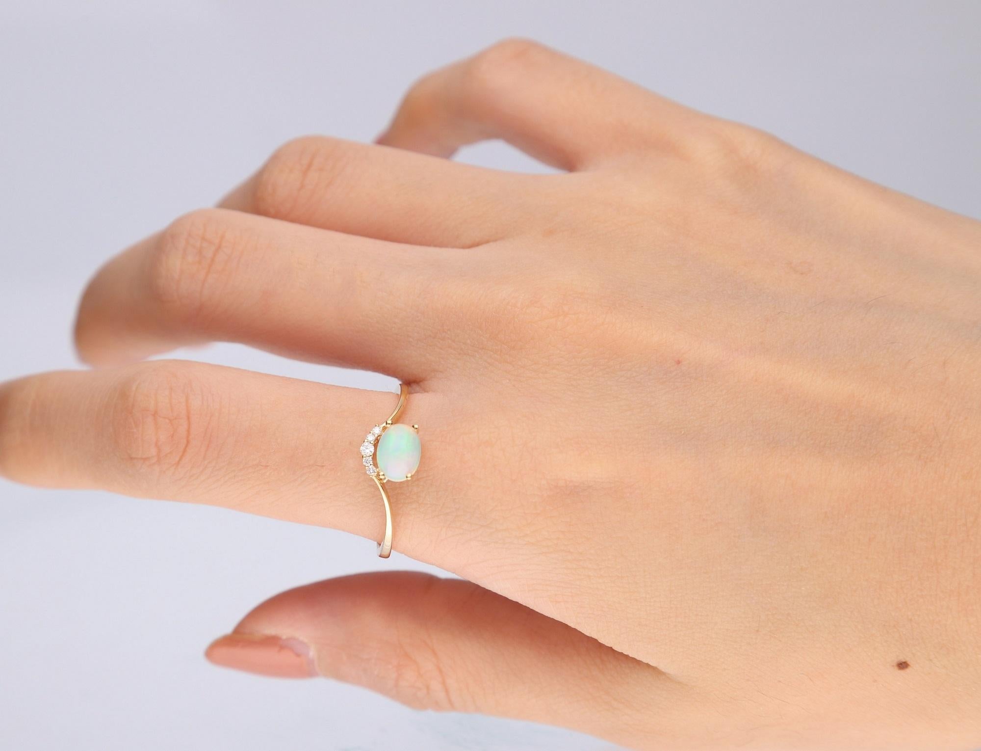Stunning, timeless and classy eternity Unique ring. Decorate yourself in luxury with this Gin & Grace ring. This ring is made up of 7x5 MM Oval-cut Prong Setting Ethiopian Opal (1pcs) 0.65 Carat and Round-Cut Prong Setting Diamond (5pcs) 0.04 Carat