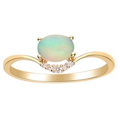 0.65 Carat Oval Cab Ethiopian Opal Diamond accents 14K Yellow Gold Ring.