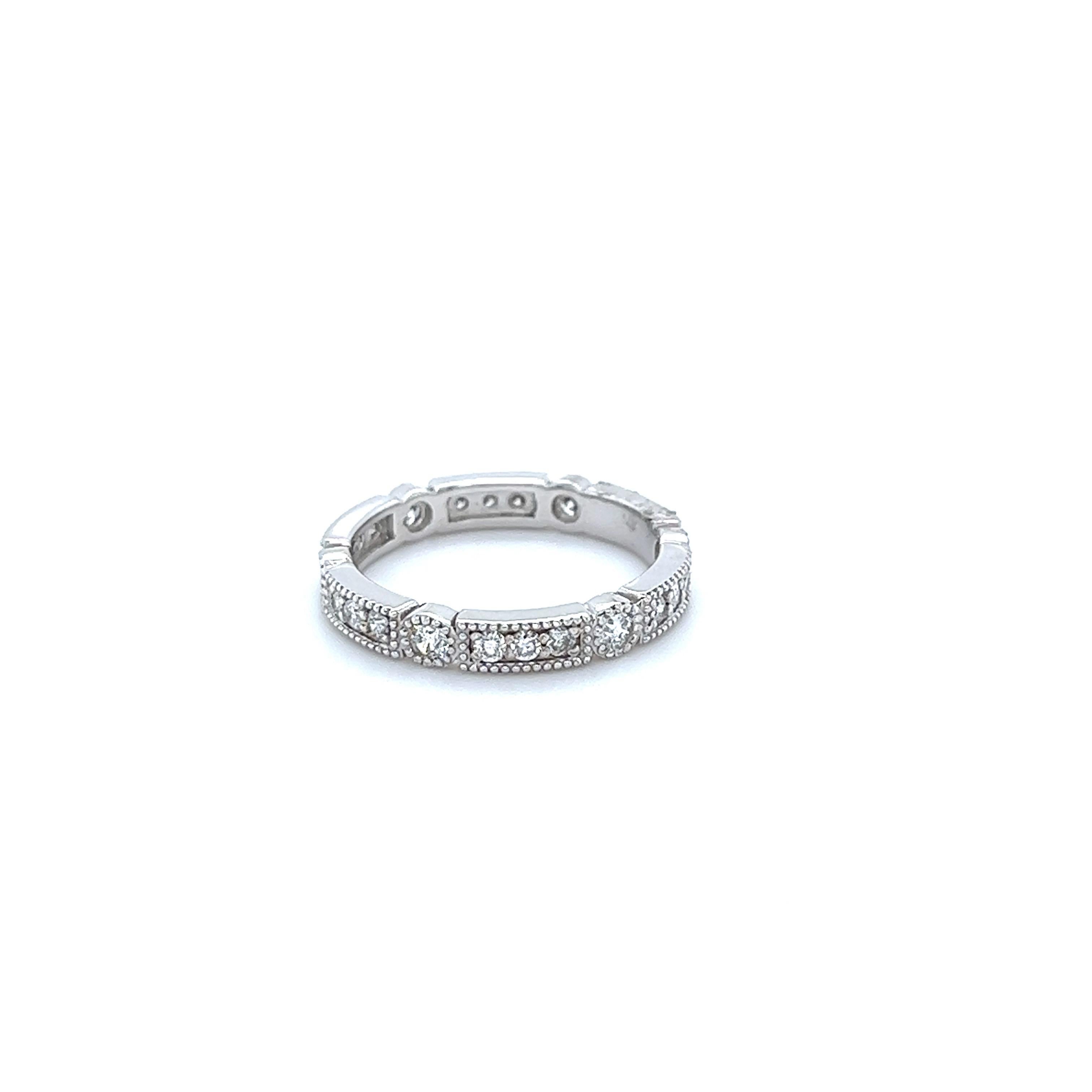 A beautiful band that can be worn as a single band or stack with other bands in other colors of Gold

This ring has 21 Round Cut Diamonds that weigh 0.65 Carats. The clarity and color of the diamonds are SI-F.

Crafted in 14 Karat White Gold and has
