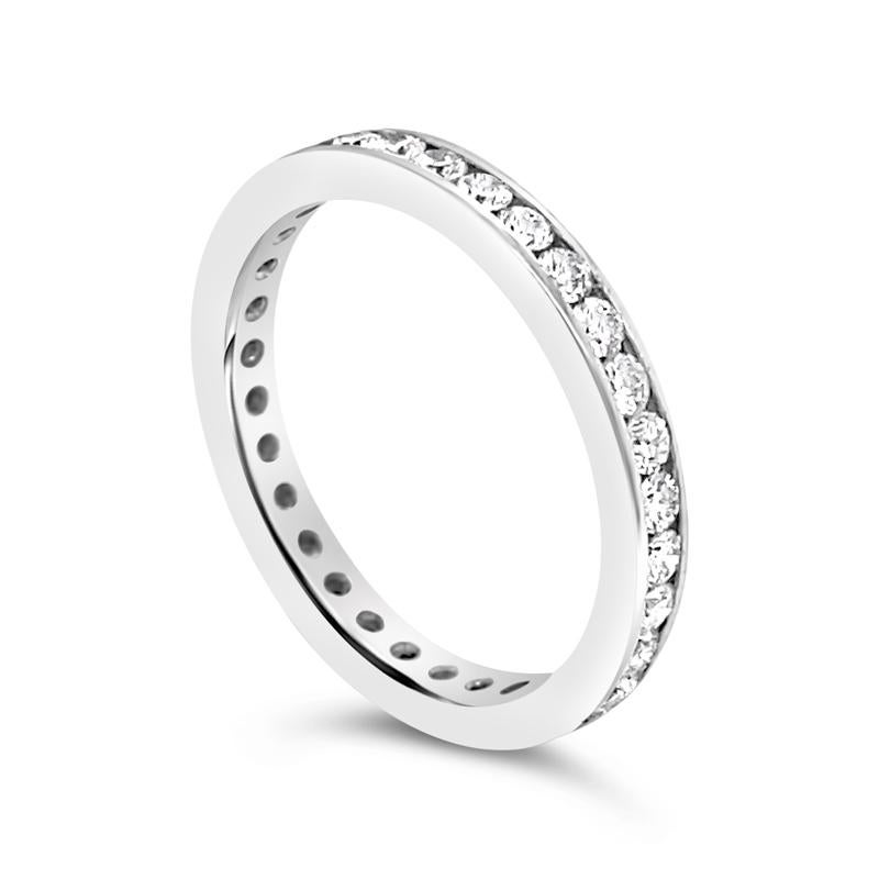 This platinum eternity band features 0.65 carat total weight in round brilliant cut channel set diamonds. This ring is a size 5.5. 
Measurements: 2.40mm wide
