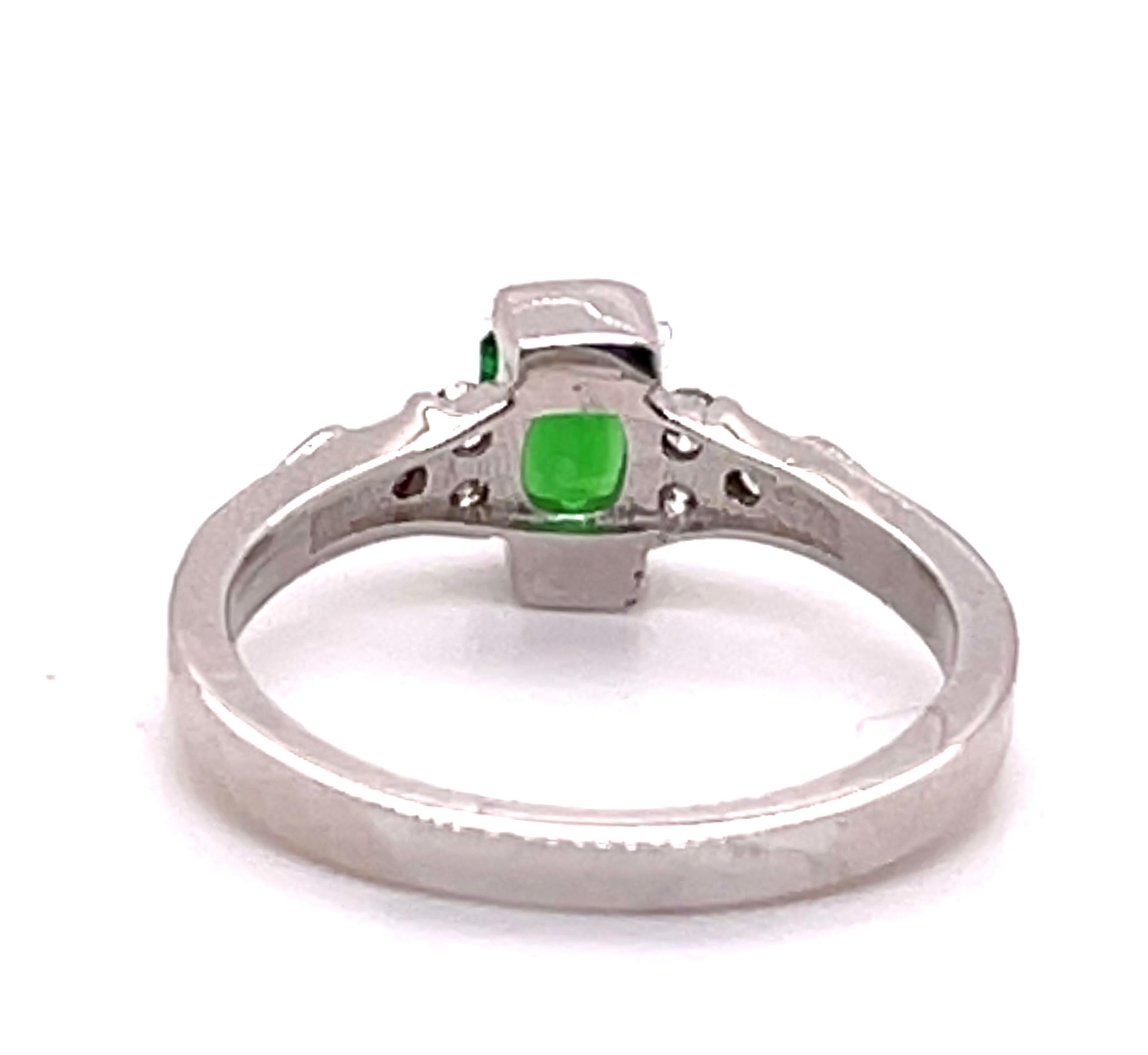 
This Tsavorite Garnet and Diamond ring in 14-karat white gold with 6 round Diamonds weighing 0.23 carats, with G color and VS clarity. The center stone is a 0.65 ct barion cut Tsavorite Garnet from Tanzania. The intense color of the stone makes up