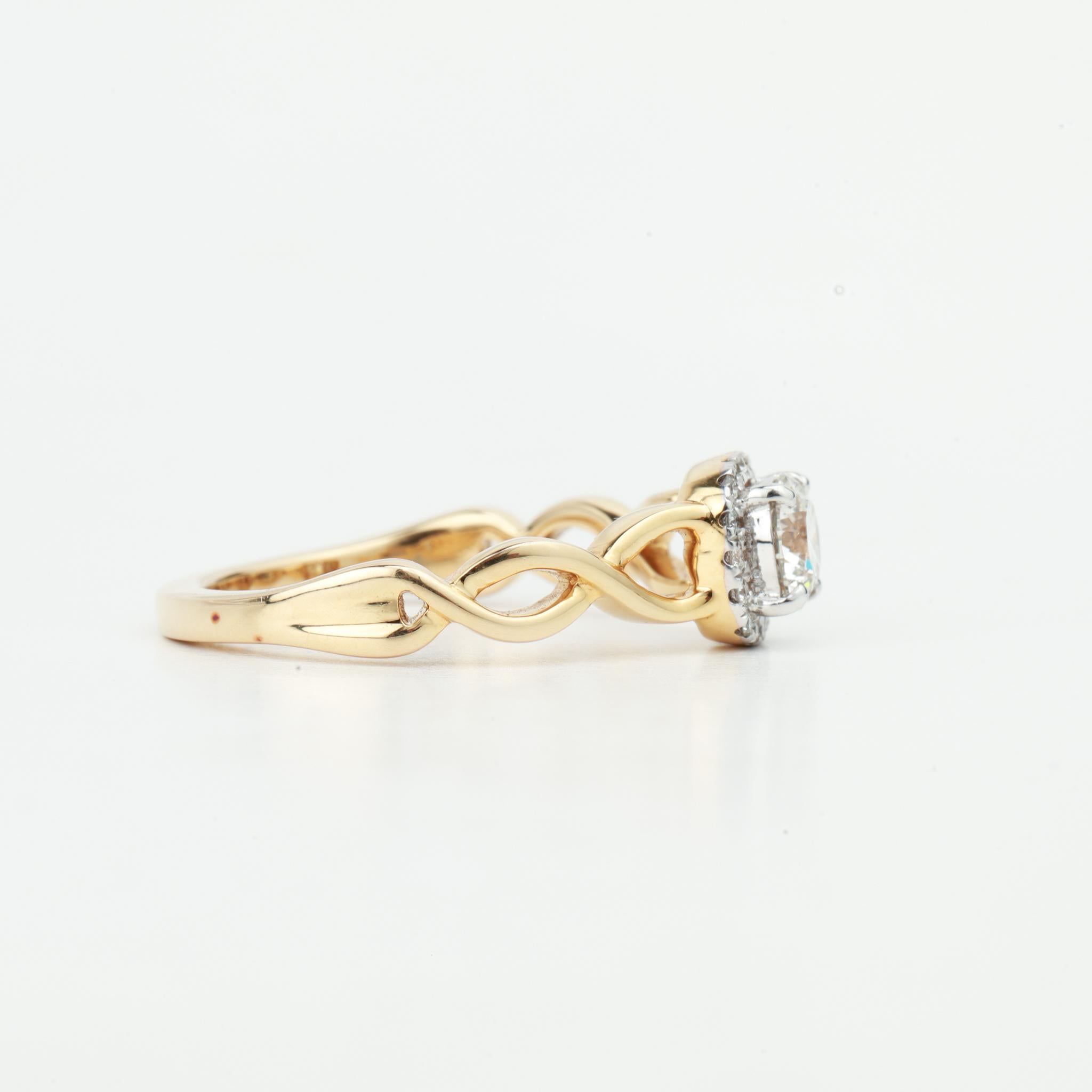 A timeless emblem of love and elegance, this exquisite halo engagement ring centers on a brilliant GIA-certified 0.66 carat natural round-cut diamond, selected for its VS clarity and luminous G color—a captivating stone with fire, precision, and
