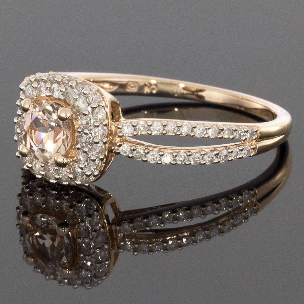This beautiful engagement ring features a morganite gemstone surrounded by a halo of diamonds. The gemstones are set in rose gold to accent the morganite's light pink color. This stunning ring is sure to catch everyone's attention! MSRP