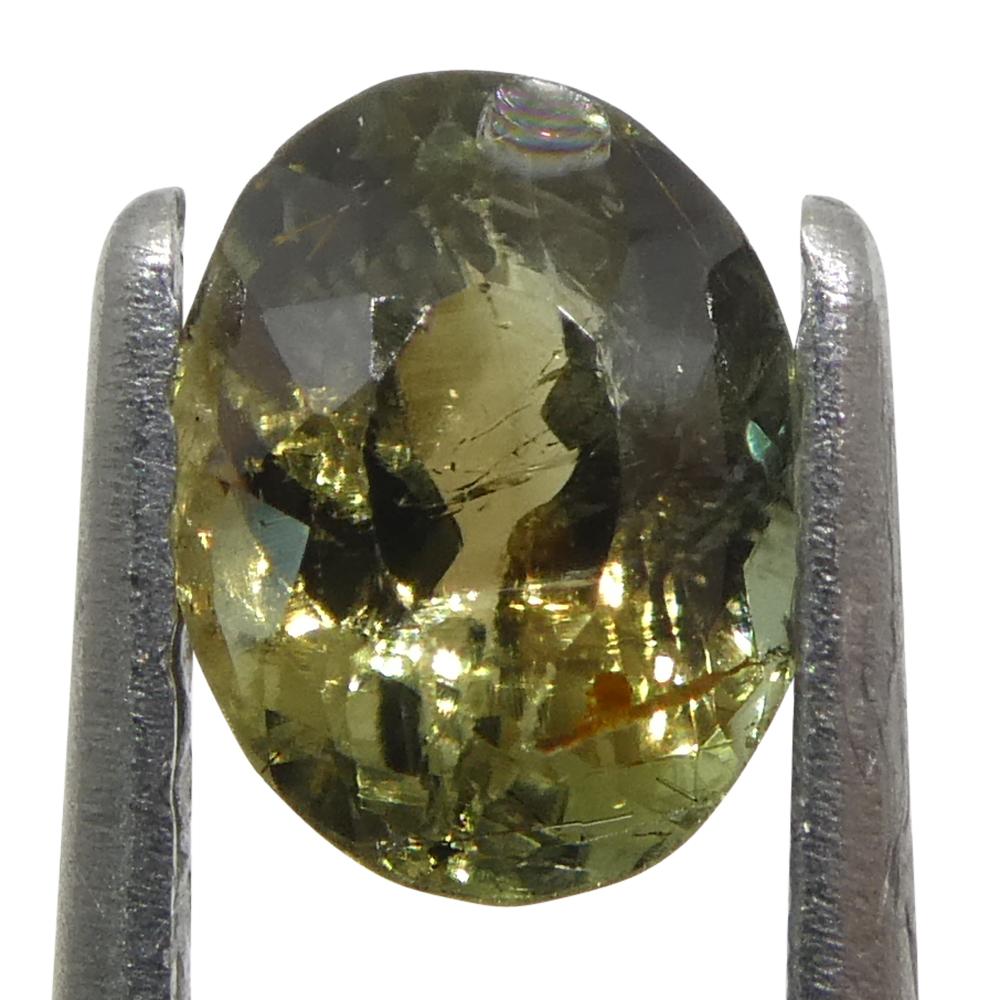 0.65ct Oval Greenish Yellow changing to Purple Alexandrite from Sri Lanka In New Condition For Sale In Toronto, Ontario