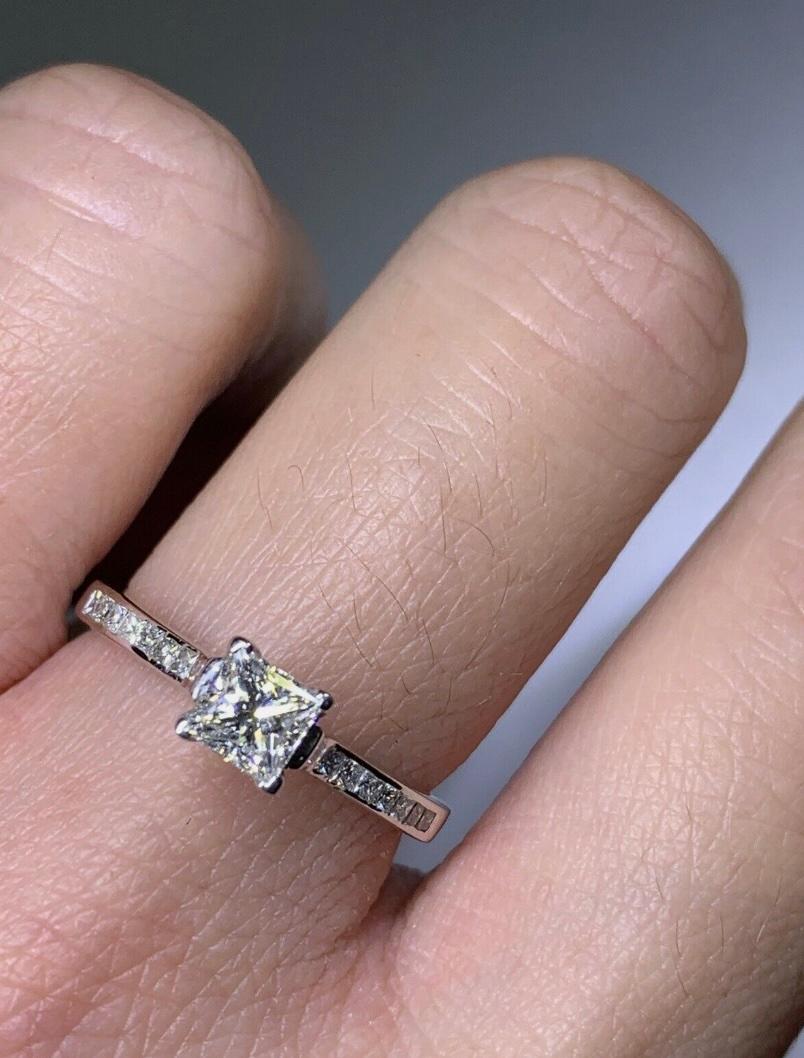 0.65ct Princess Cut Diamond Solitaire Engagement Ring 18ct White Gold
0.65ct Princess Diamond Engagement Ring With Diamond Halo In 18k White Gold.

Classic diamond princess cut diamond engagement ring.

The ring can be resized

Hallmarked.

Center