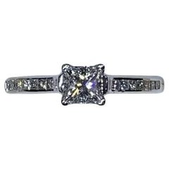 0.65ct Princess Diamond Engagement Ring With Diamond Halo In 18k White Gold.