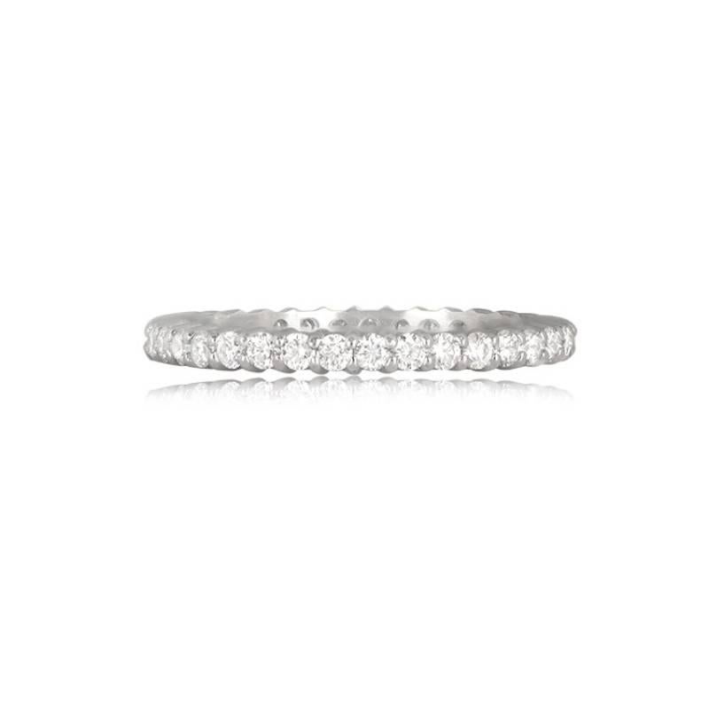 An elegant platinum eternity band adorned with round brilliant cut diamonds, skillfully set with shared prongs. The band boasts a total approximate diamond weight of 0.65 carats, making it a timeless and sparkling piece.

Ring Size: 6.5 US,