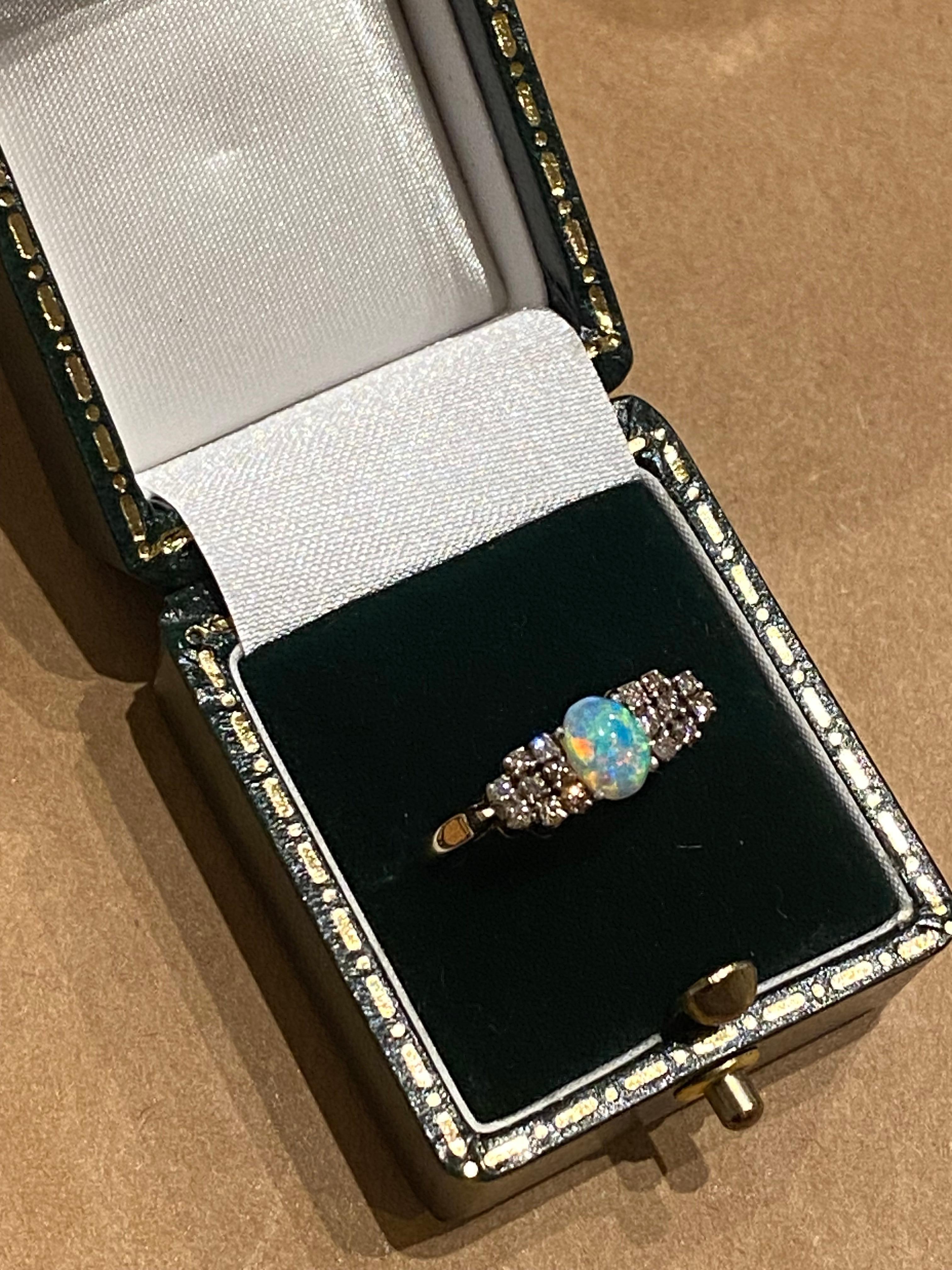 Oval Cut 0.65ct Solid Australian Crystal Opal & 0.50ct Round Diamond Ring in 9K Gold. For Sale