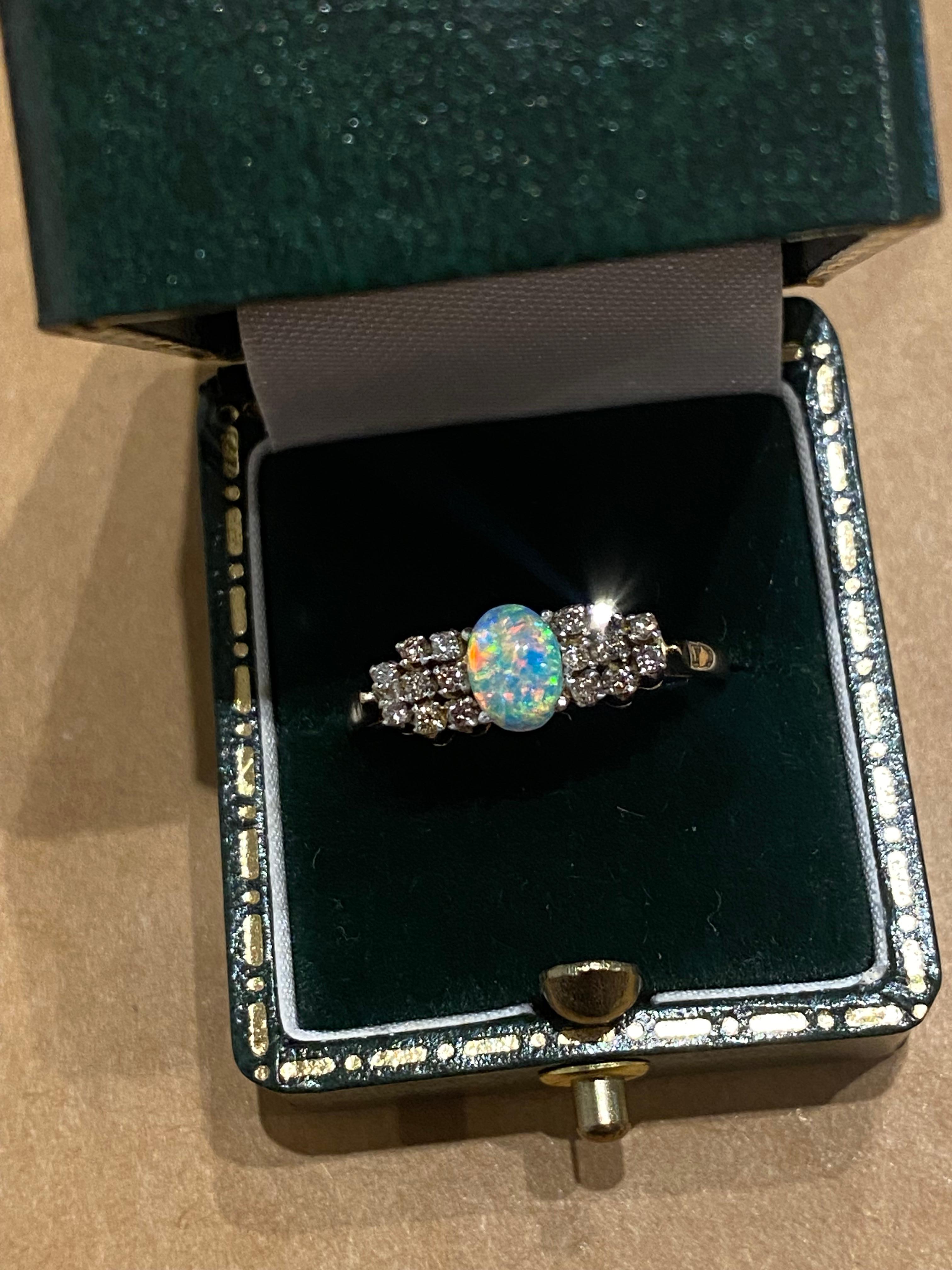 Women's 0.65ct Solid Australian Crystal Opal & 0.50ct Round Diamond Ring in 9K Gold. For Sale