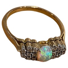 Vintage 0.65ct Solid Australian Crystal Opal & 0.50ct Round Diamond Ring in 9K Gold.