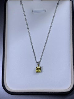 0.65ct Yellow sapphire pendant in 18ct white gold.