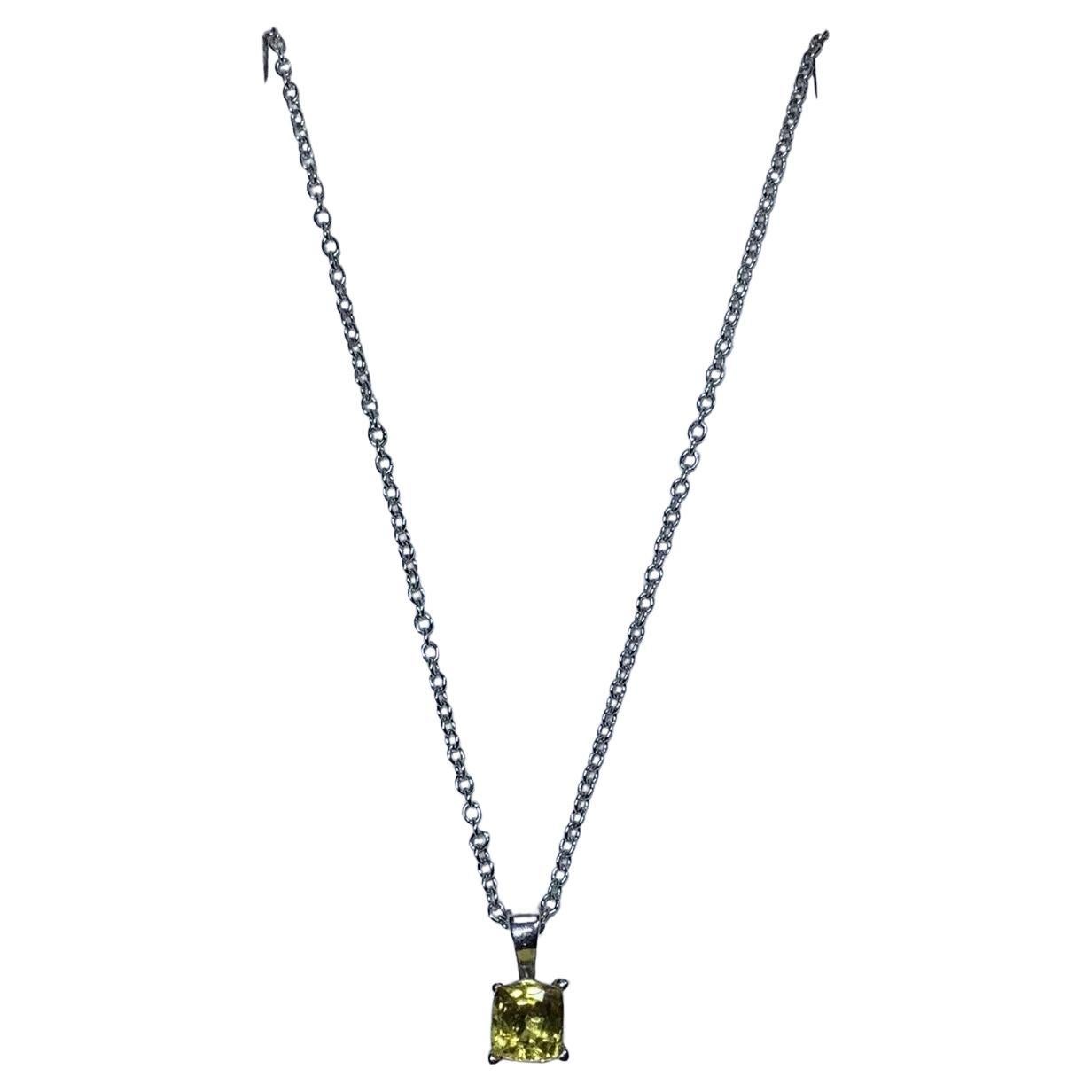 0.65ct Yellow sapphire pendant in 18ct white gold.