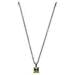 0.65ct Yellow sapphire pendant in 18ct white gold.
