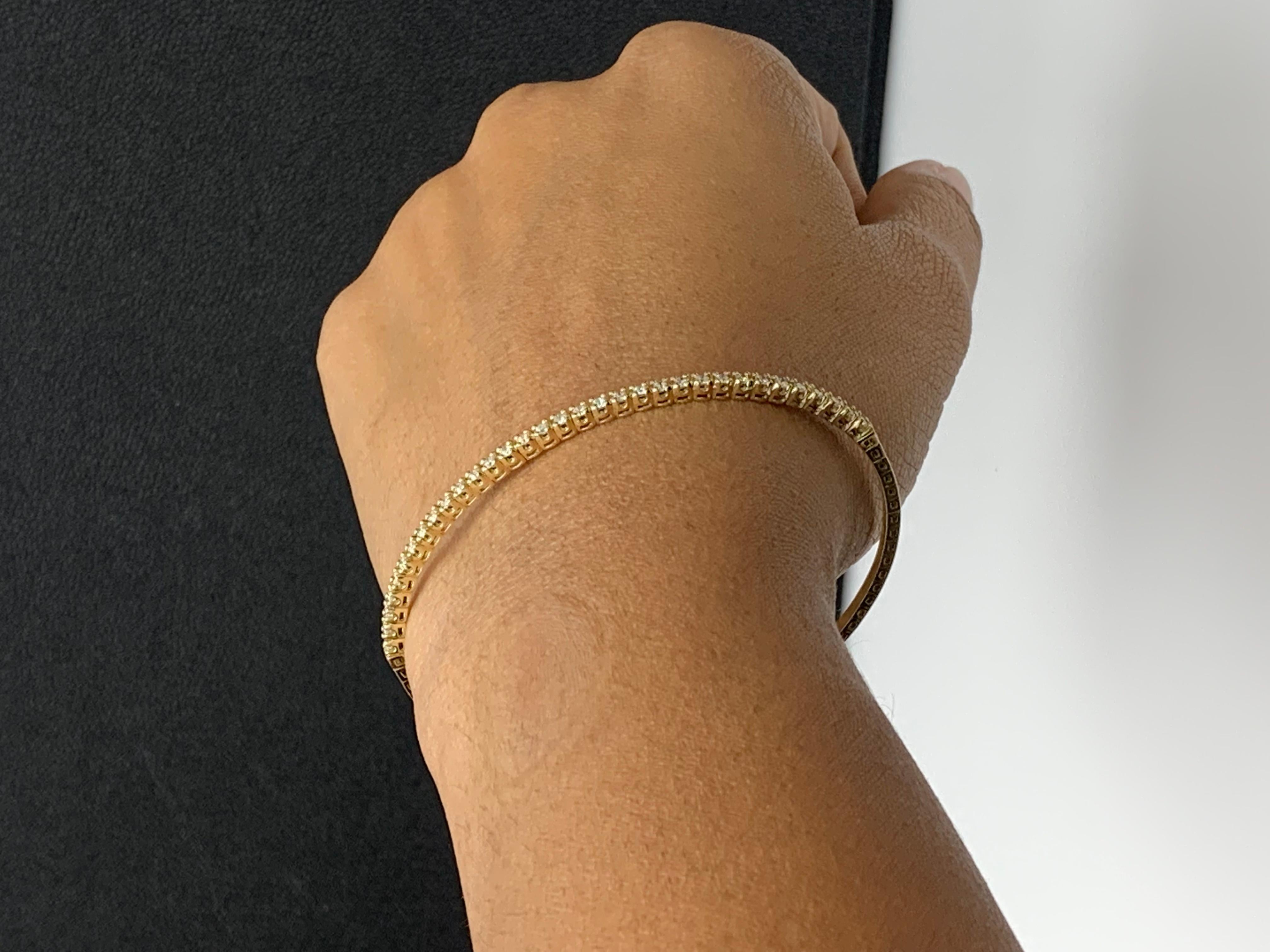 Bracelet jonc en or jaune 14 carats avec diamants taille ronde brillants de 0,66 carat en vente 13