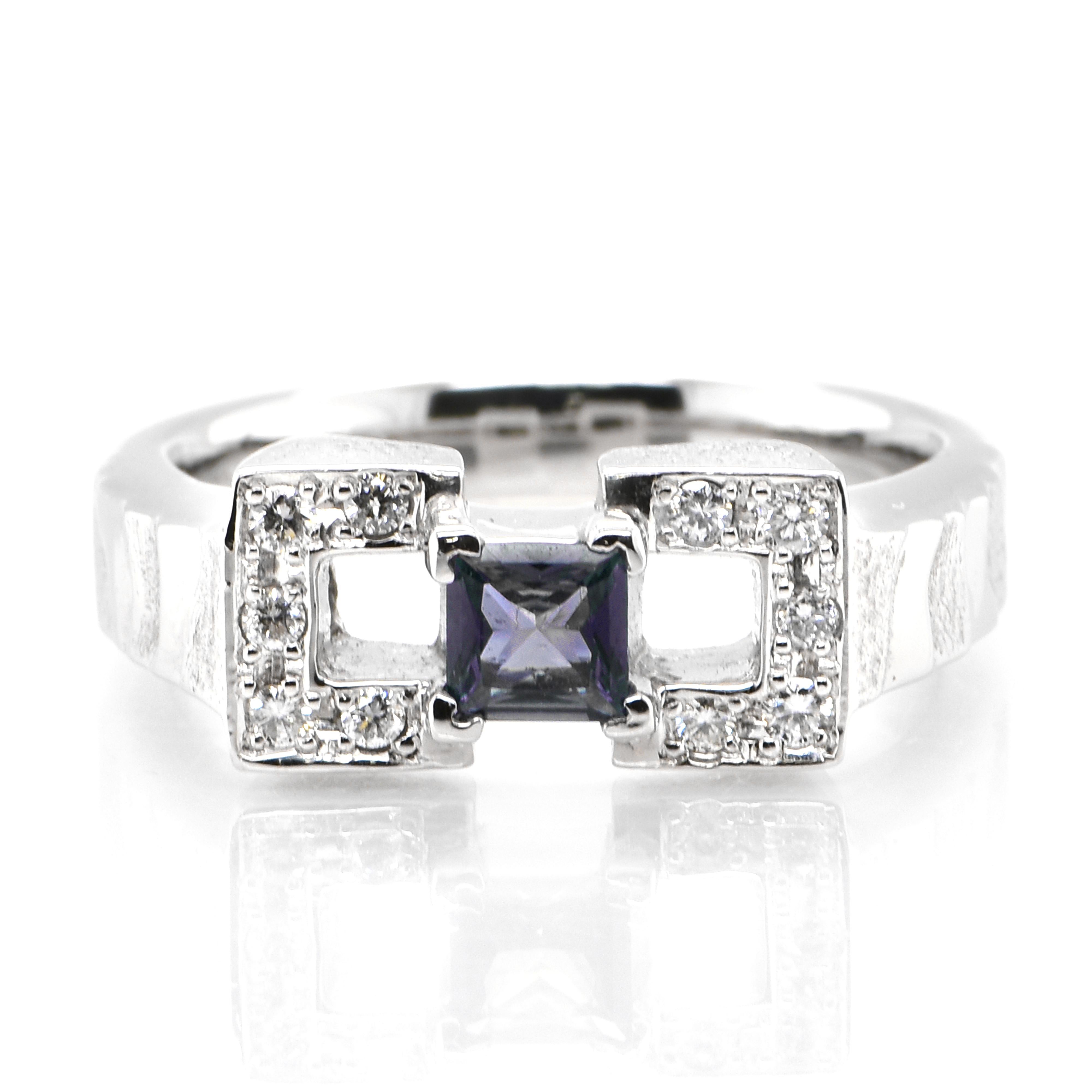 A gorgeous ring featuring 0.66 Carat, Natural Alexandrite and 0.17 Carats of Diamond Accents set in Platinum. Alexandrites produce a natural color-change phenomenon as they exhibit a Bluish Green Color under Fluorescent Light whereas a Purplish Red