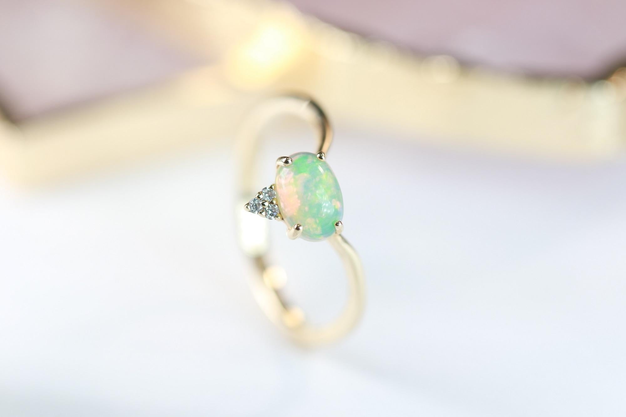 Oval Cut 0.66 Carat Oval Cab Ethiopian Opal And Round-Cut Diamond 14K Yellow Gold Ring For Sale