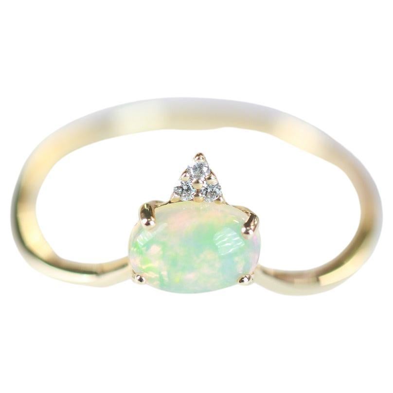 0.66 Carat Oval Cab Ethiopian Opal And Round-Cut Diamond 14K Yellow Gold Ring For Sale