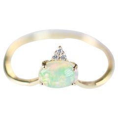 0.66 Carat Oval Cab Ethiopian Opal And Round-Cut Diamond 14K Yellow Gold Ring