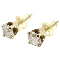 Orecchini con diamante tondo brillante da 0,66 carati in oro giallo 14 carati