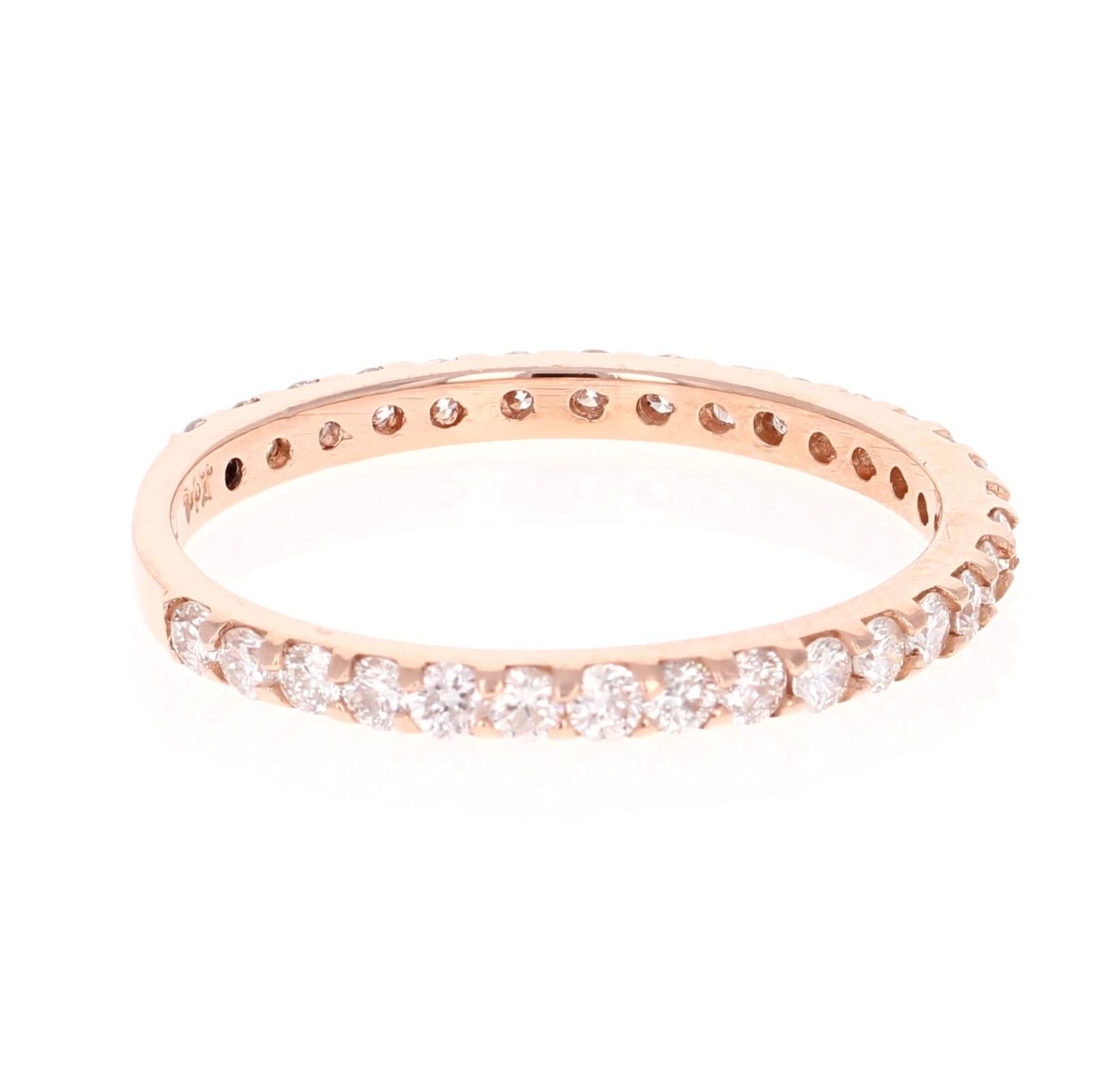 A beautiful band that can be worn as a single band or stack with other bands in other colors of Gold! 

This ring has 30 Round Cut Diamonds that weigh 0.66 Carats. The clarity and color of the diamonds are SI-F.

Crafted in 14 Karat Rose Gold and is