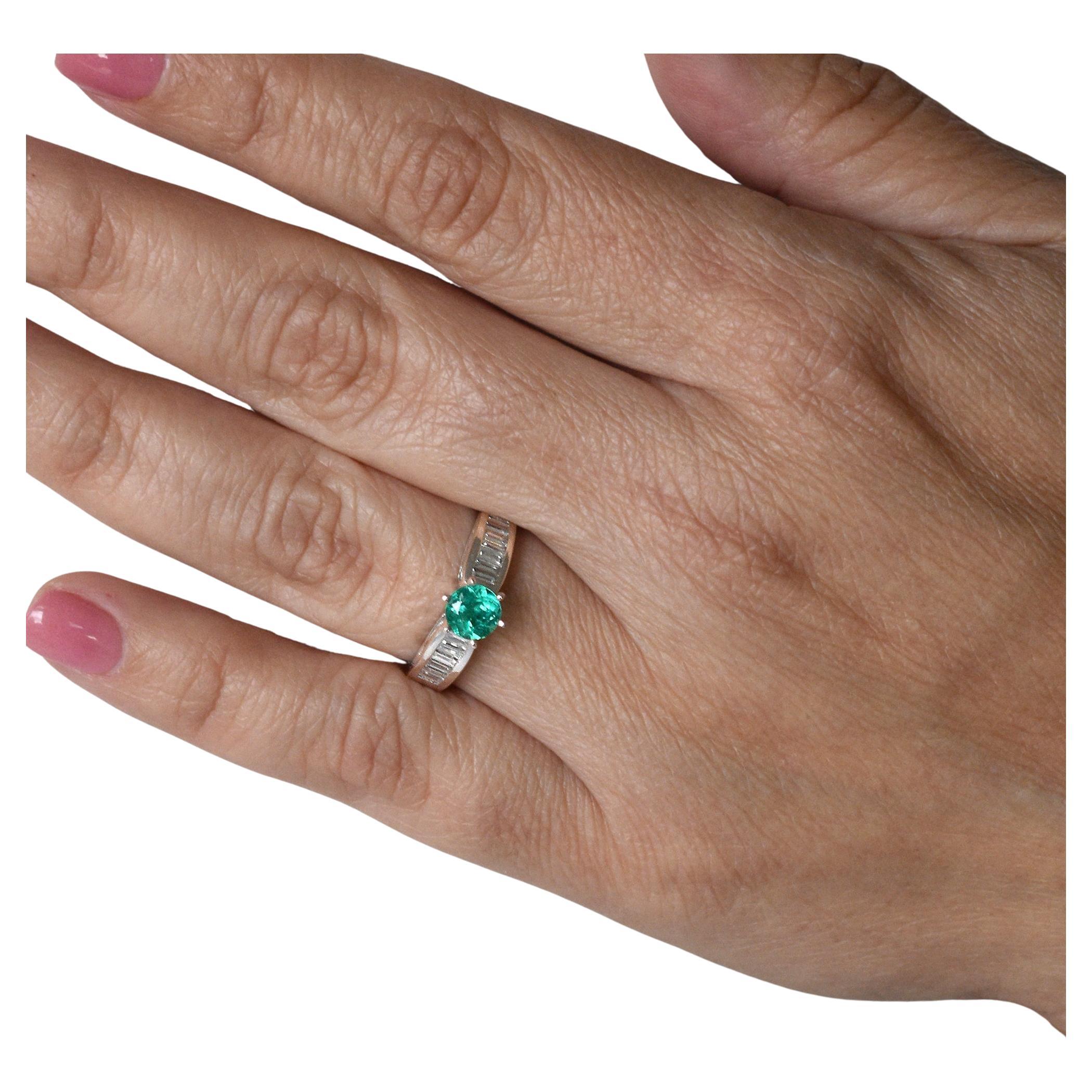 0.66 Carats Emerald Engagement Ring in White Gold With Baguette Cut Diamonds For Sale