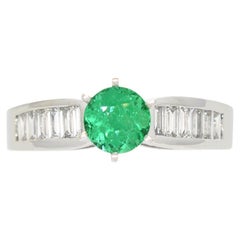 0.66 Carats Emerald Engagement Ring in White Gold With Baguette Cut Diamonds