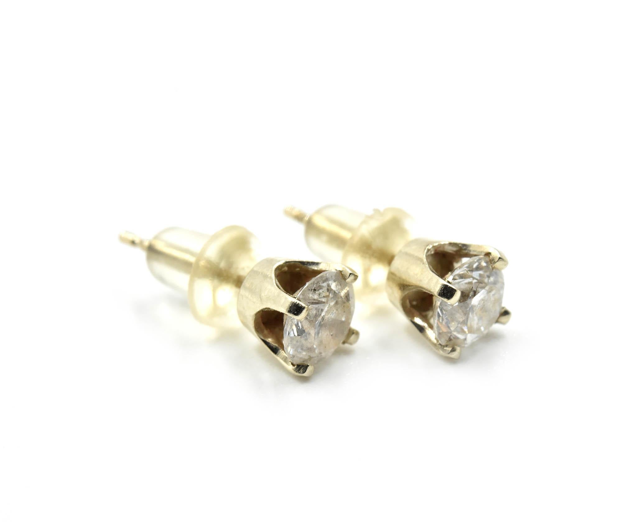 Designer: custom design
Material: 14k yellow gold
Diamonds: two round brilliant cuts = 0.66 carat total weight
Fastenings: friction backs
Dimensions: each earring measures 4.60mm in diameter
Weight: 0.83 grams

