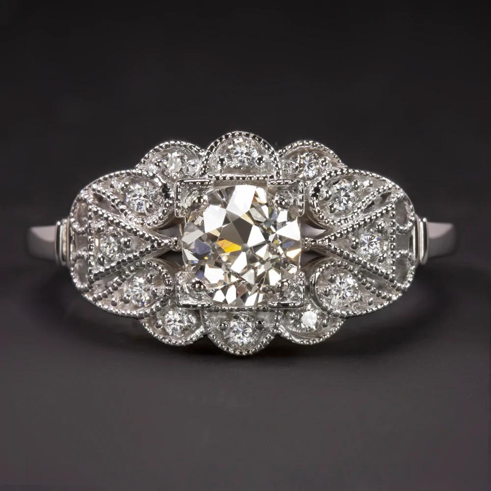 Gorgeous vintage style engagement ring featuring a beautifully white and fully eye clean old European cut center diamond set in diamond encrusted 14k white gold.
The center diamond is GIA certified and was hand cut during the Art Deco era with large