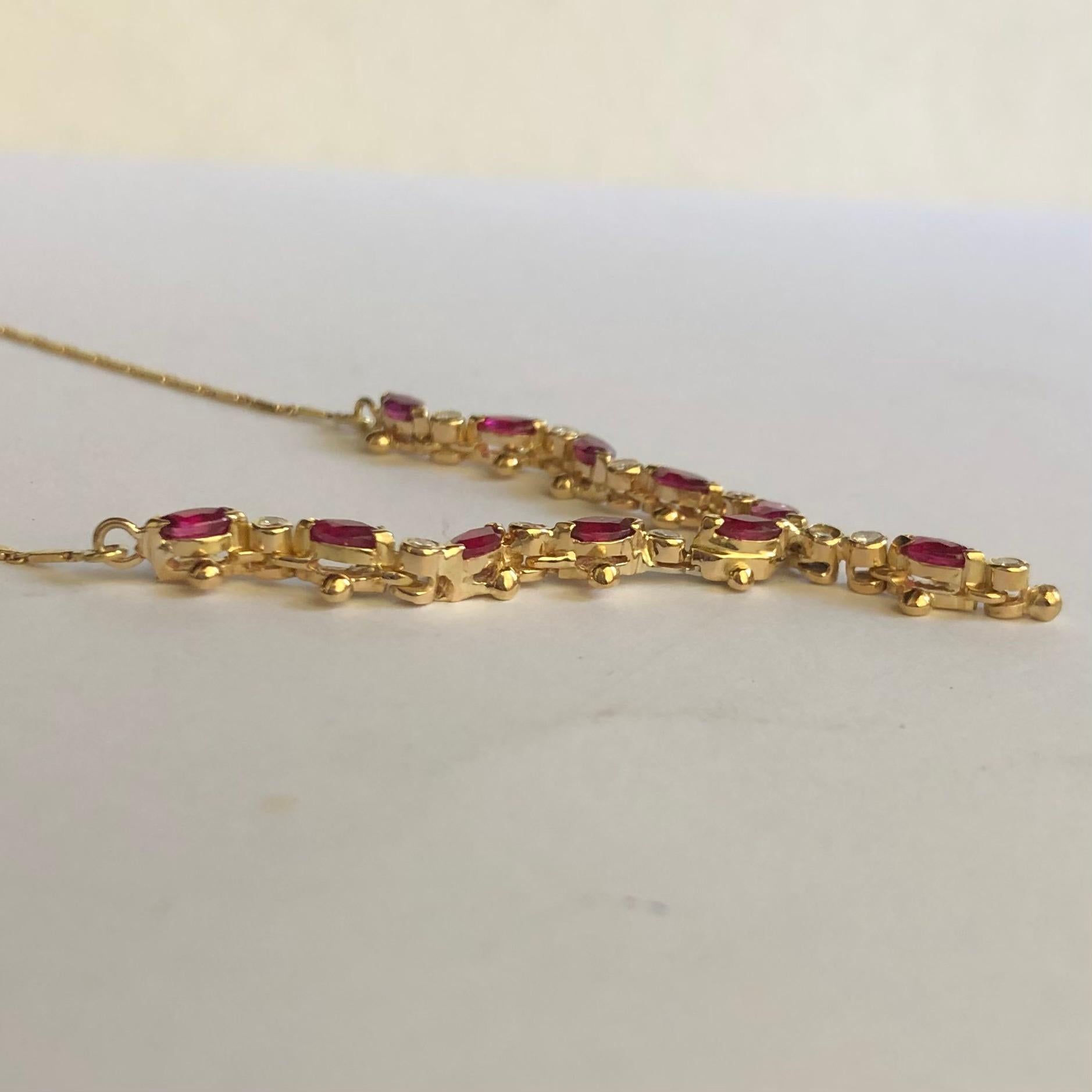 Oval Cut 0.66 Ct Oval Rubies and 0.11 Ct Round Diamonds on a 18k Yellow Gold Necklace
