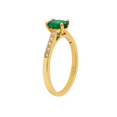 0.67 Carat Emerald and Diamond 18 Carat Yellow Gold Engagement Ring
