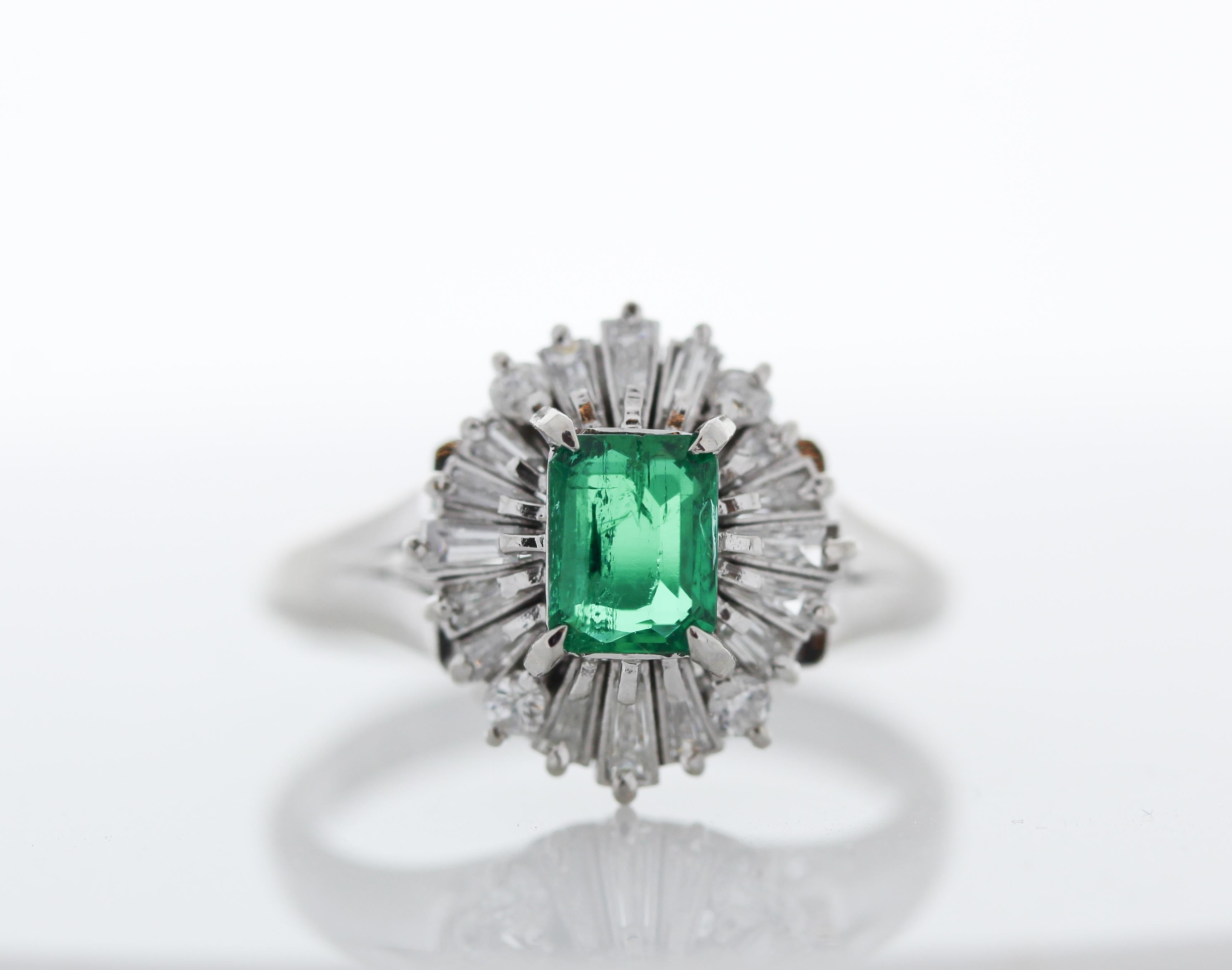 Contemporary 0.67 Carat Emerald Cut Emerald & Diamond Cocktail Ring in Platinum For Sale