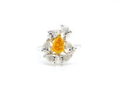 0.67 Carat GIA Certified Fancy Vivid Yellow-Orange Diamond and Diamond Ring