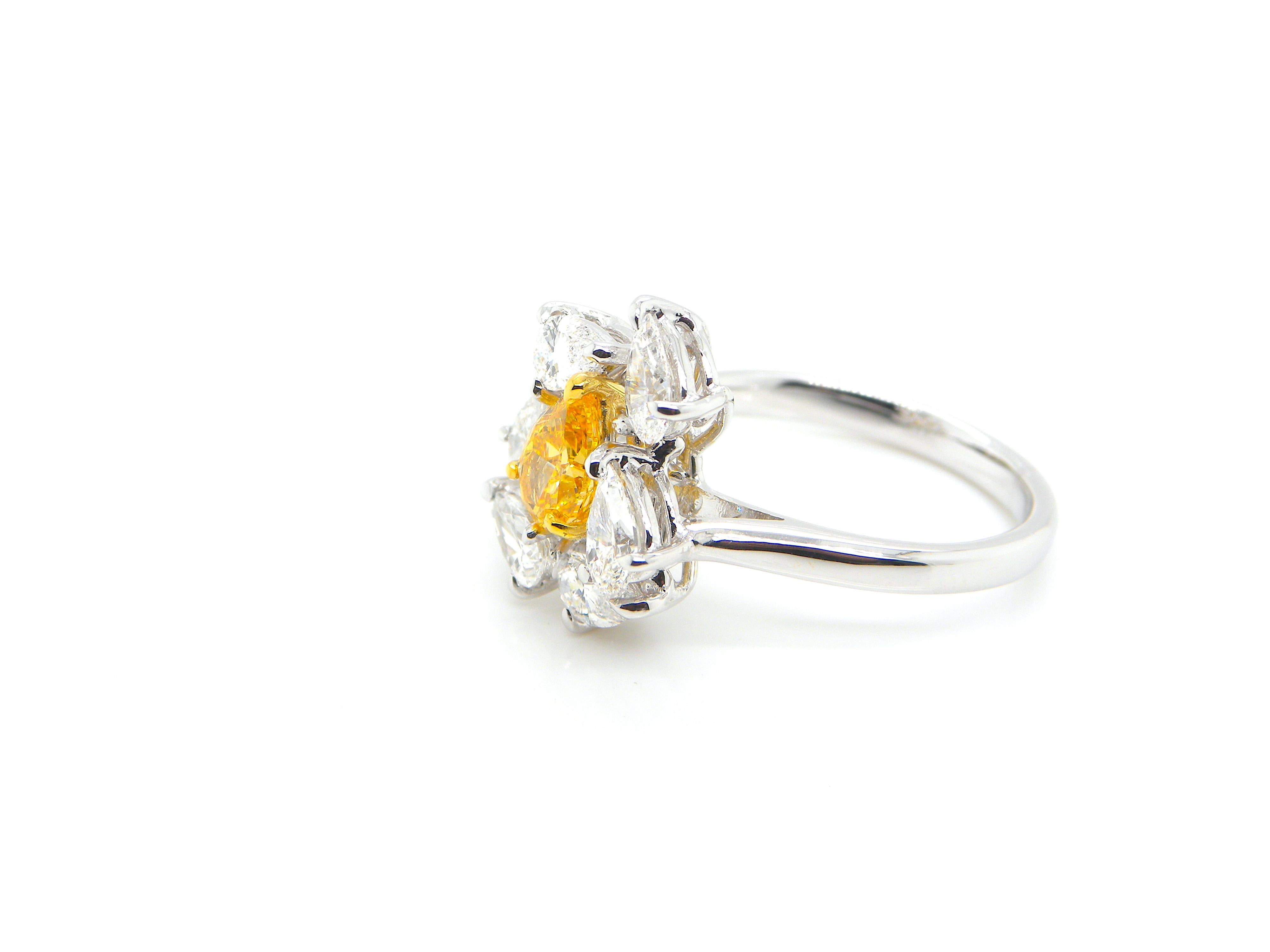 0.67 Carat GIA Certified Fancy Vivid Yellow-Orange Diamond and Diamond Ring 1